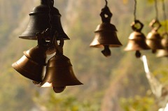 Copper bells, hanging in sunlight
