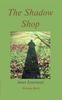 Cover of The Shadow Shop, which is predominantly green. It's green and sunny grass, over which the long shadow is cast of perhaps a woman on a long dress. Above the title in lower case italics red, and below the italic name of the author in dark green.